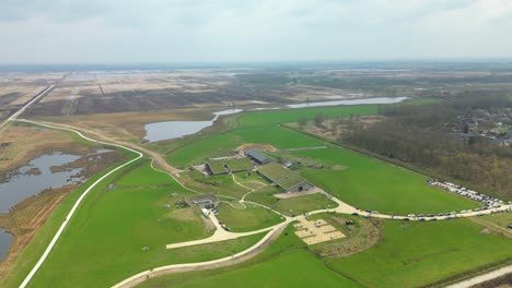 Stunning-Aerial-Views-of-Sheep-House-and-Idyllic-Rural-Fields-and-Lakes-in-Netherlands