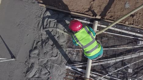 concrete is poured into new house framing to create solid floor build