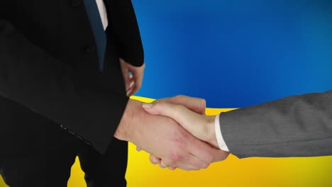 Animation-of-caucasian-business-people-shaking-hands-over-flag-of-ukraine