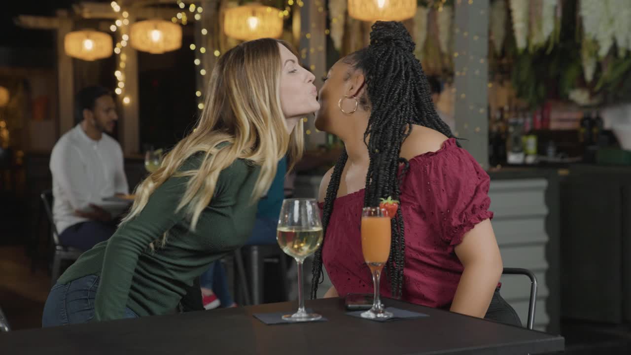 Tracking Shot of a Woman Joining Another Woman In a Bar