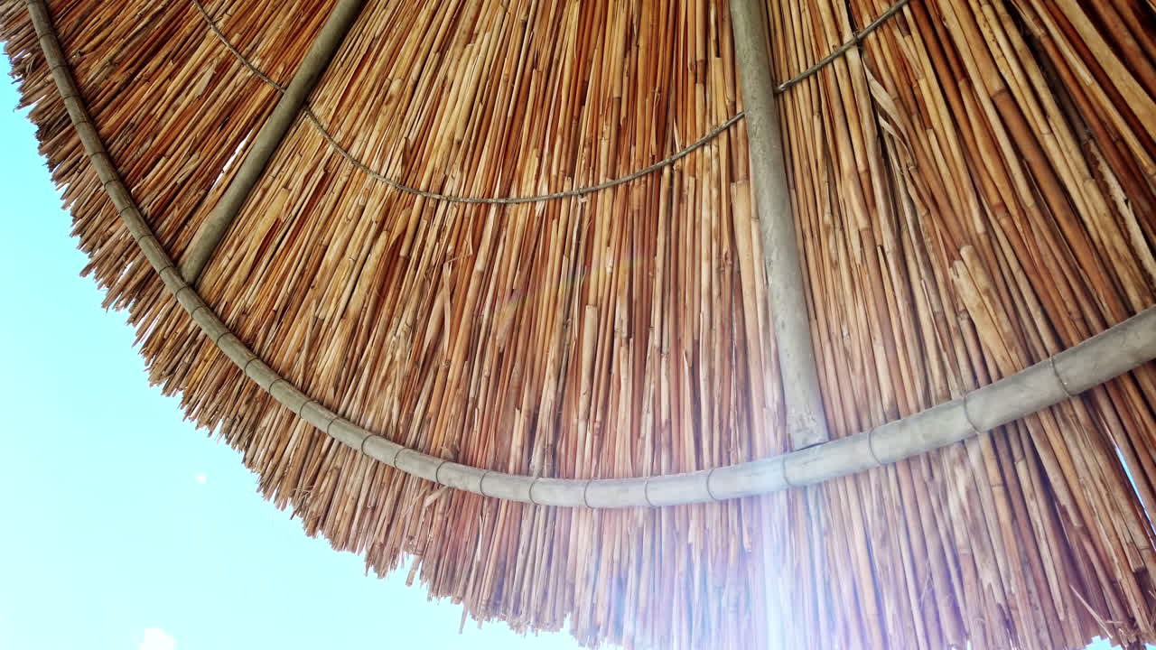 Beach umbrella lying on the Aegean sea coast in Asprovalta, Greece