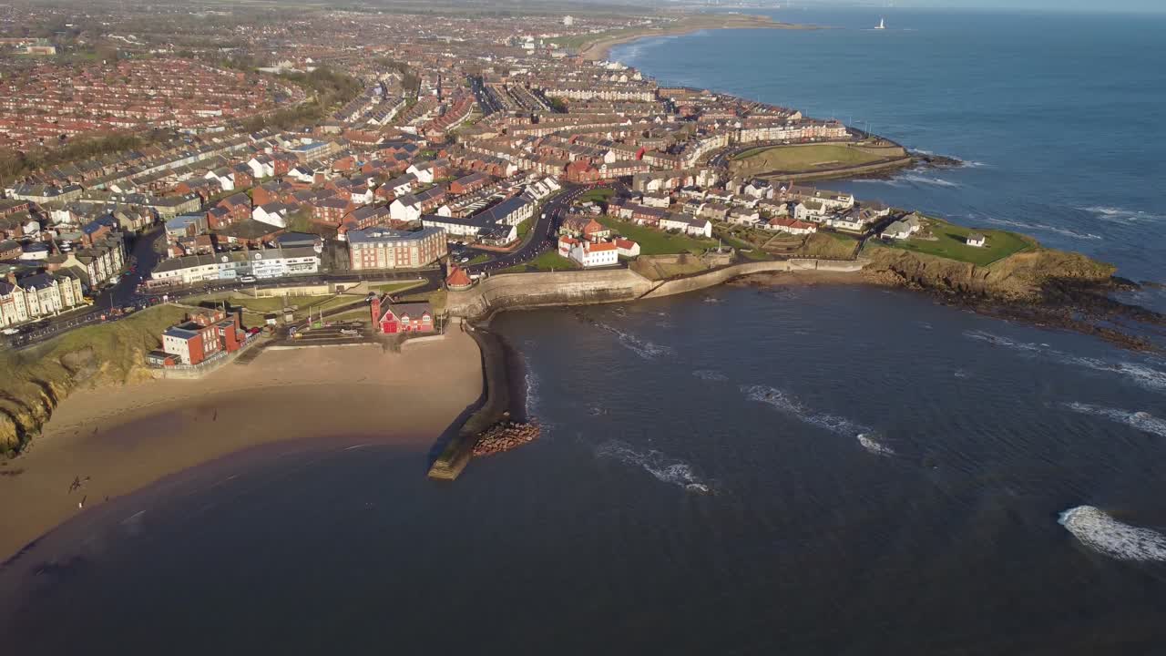 Revealing Cullercoats beach with North Tyneside coast looking North towards Whitley Bay on sunny morning