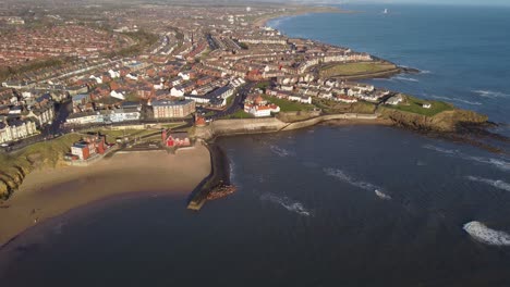 revealing cullercoats beach with north tyneside coast looking north towards whitley bay on sunny morning