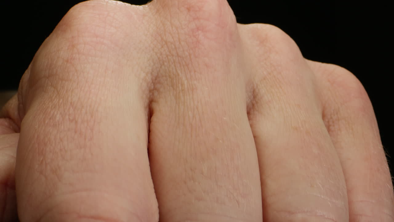 Close-up of man hand skin texture. Macro Detailed human skin, lines on hand palm.