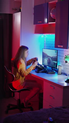 woman playing on computer. girl sits in the simulator of a car and playing the game
