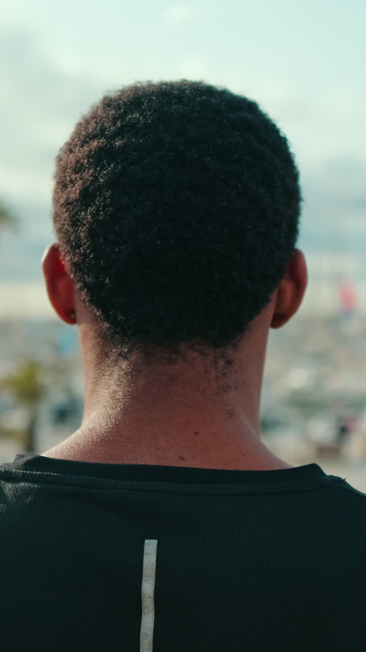 Young Man in Black Tank Top at Marina