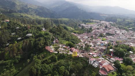 colombian settlement in the mountain andes, city salento, aerial orbit