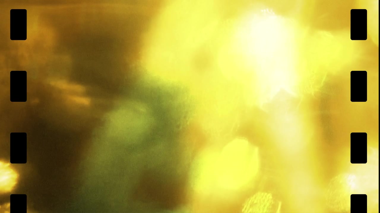 Vintage Film Reel Overlay with Flickering Yellow and Green Light Leaks