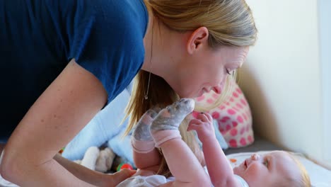 mother playing with her baby boy at home 4k