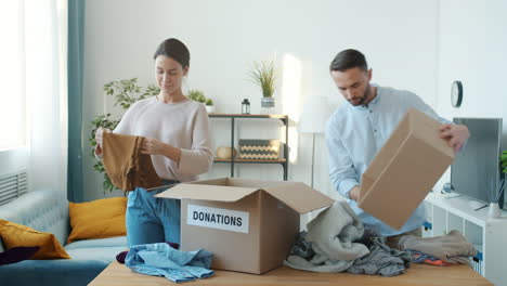 family donating clothes
