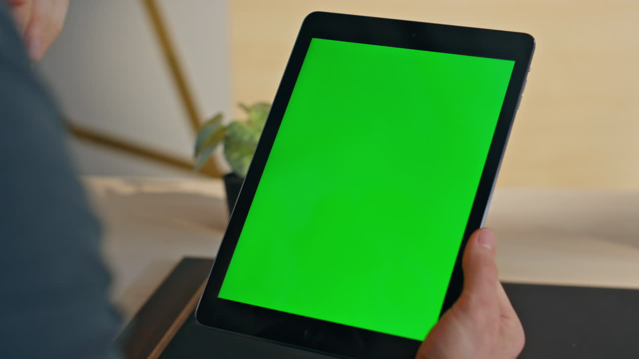 Freelancer hand tapping mockup tablet touchscreen sitting home workplace closeup