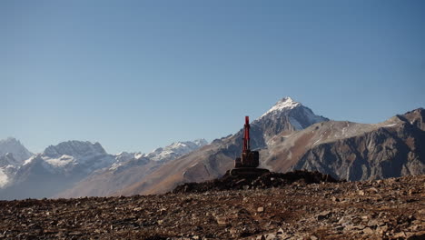 excavator working in mountainous terrain