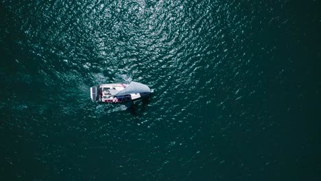 top down aerial view over sailing sail boat in the mediterranean sea near france