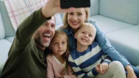 family making a selfie in living room