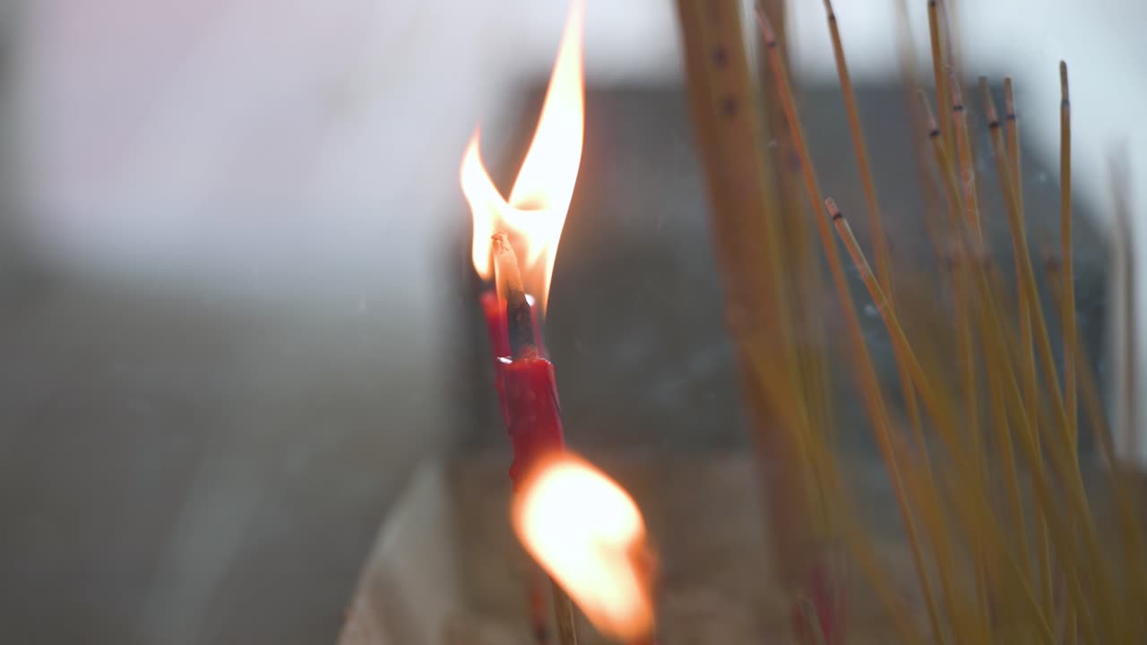 Candles light at a cemetery during the annual Chung Yeung Festival as citizens visit deceased relatives' graves and bring offerings in remembrance and respect
