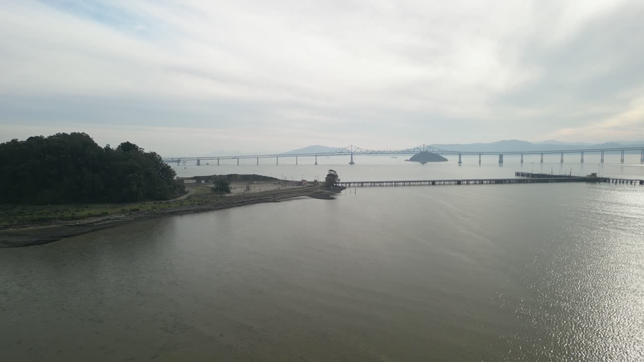 High-altitude aerial view of the Richmond–San Rafael Bridge near the scenic Point Molate Beach.