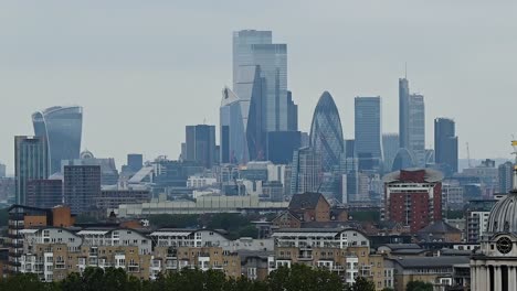 the view of central london from within greenwich park in june 2021 on a cloudy day