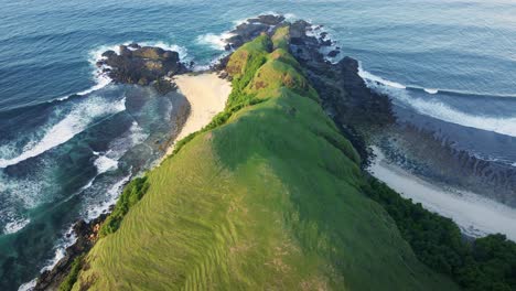 epic view of merese hills, mandalika, lombok island with stunning waves crashing over the cliffs and the white sandy shore below the hills