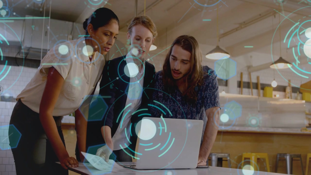 Center woman lifting sheet, pointing screen, team reviewing design as holo UI highlighting parts