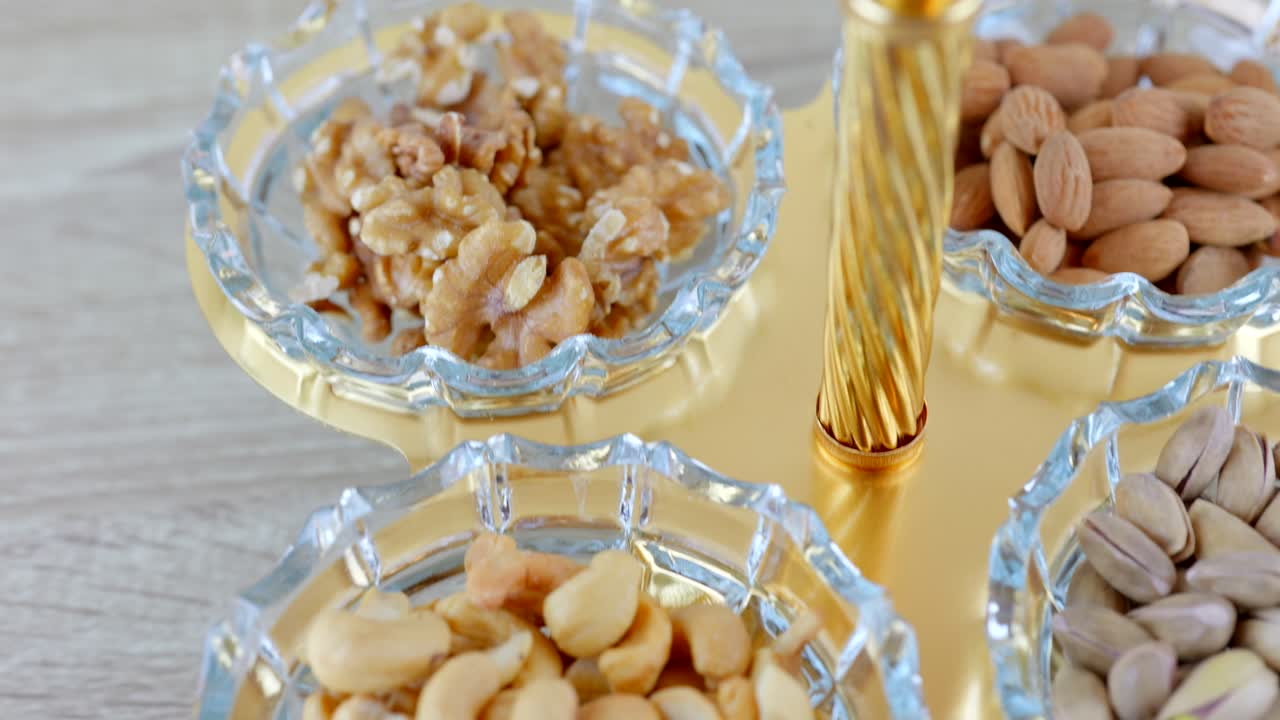 Opulence and elegance of platters filled with an assortment of luxurious nuts, beautifully presented in exquisite bowls