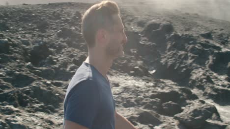 male traveler walking near blowhole