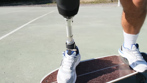 Closeup-shot-of-man-with-prosthetic-leg-skateboarding-outdoors