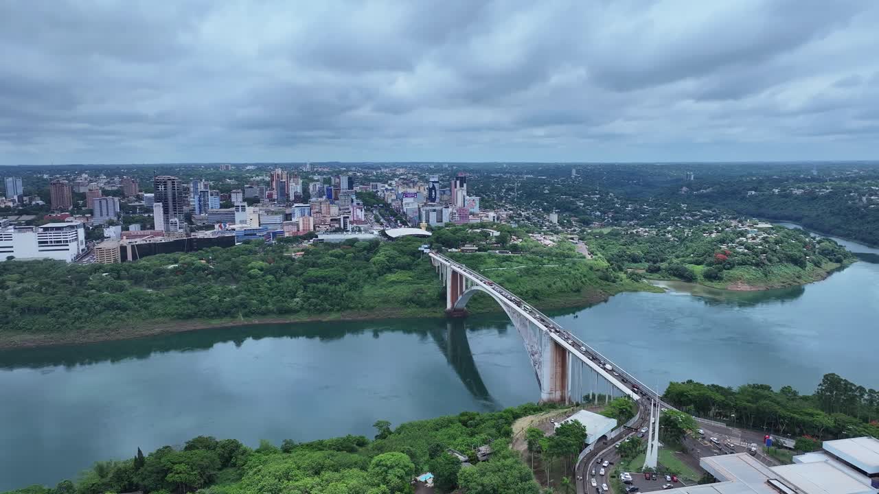 Drone view of the International Friendship Bridge highway 277 over the Parana River connecting Foz do Iguaçu Brazil to Ciudad del Este Paraguay in the background