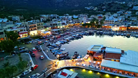 port of elounda, greece, is illuminated by the soft golden light of sunset