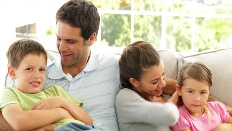 Cute-family-relaxing-together-on-the-couch