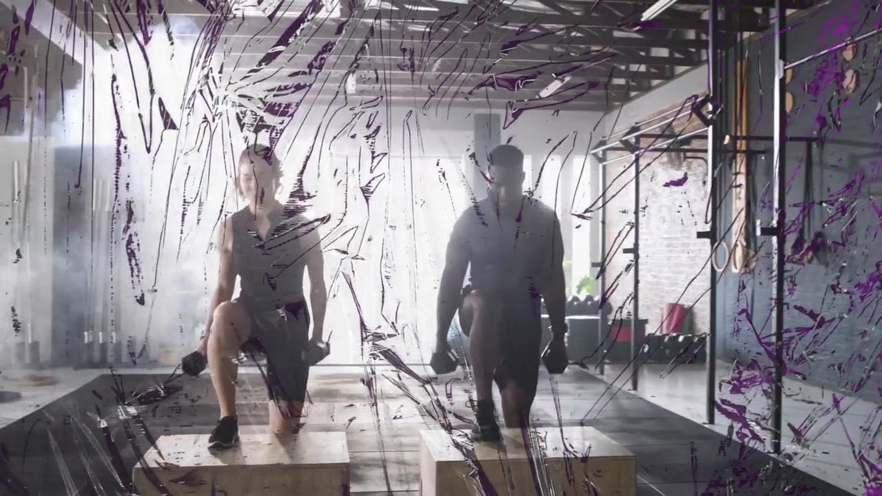 Starting behind boxes two athletes stepping and lunging with dumbbells for strength training