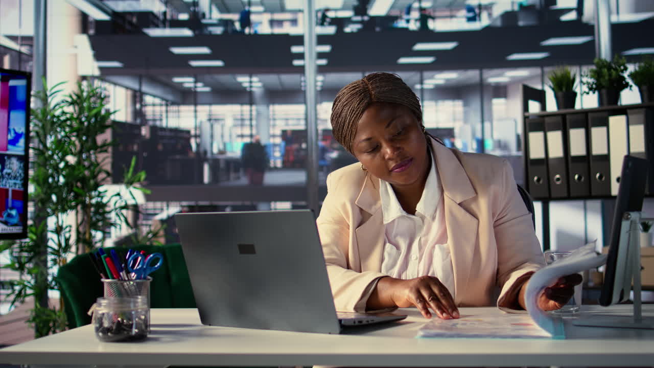 Businesswoman Reviewing Documents in Modern Office