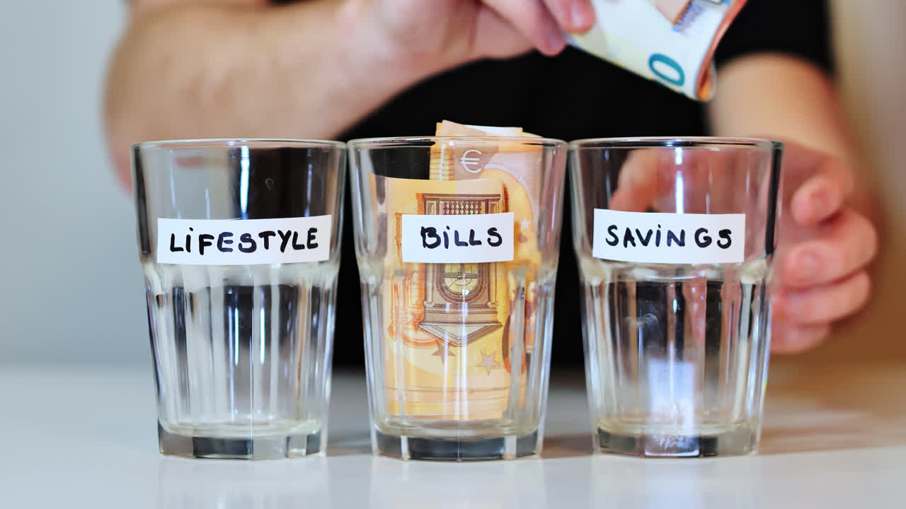 Man prioritizes saving - placing last cash into savings jar, empty lifestyle jar