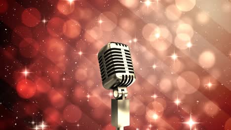 Animation-of-snow-falling-over-microphone-against-spots-of-light-and-shining-stars-on-red-background