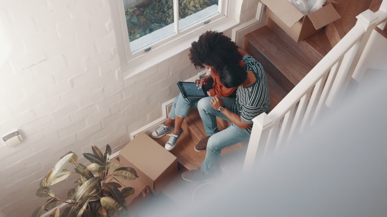 Tablet, real estate and couple on the stairs