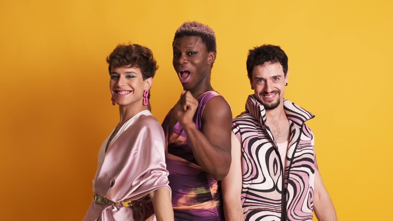 Multiethnic transgender men dancing in studio