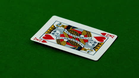 King-of-hearts-falling-on-casino-table