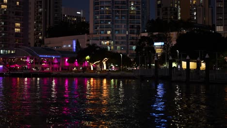colorful lights reflecting on canal water