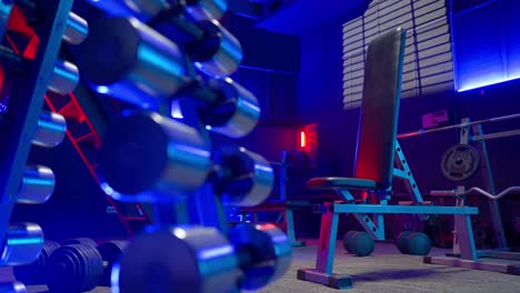 Modern Home Gym with Blue and Red Lighting
