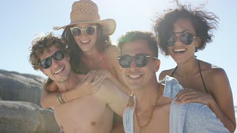 beach couples giving piggybacks laughing having fun on vacation