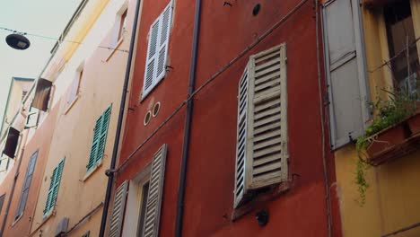 colorful italian building facade with shutters