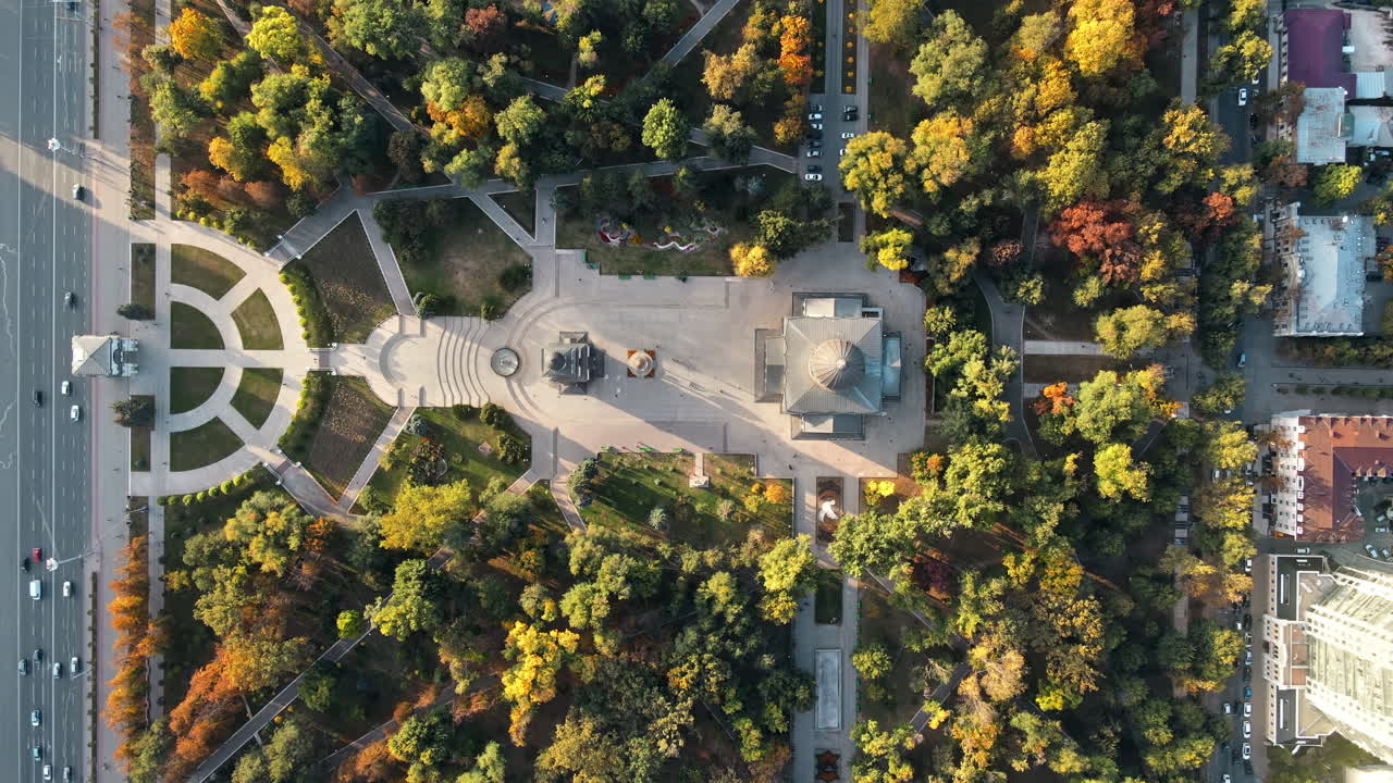 Aerial drone view of Chisinau downtown at sunset. Vertical view of central park, Cathedral, bell tower, Triumphal Arch, a lot of greenery. Moldova