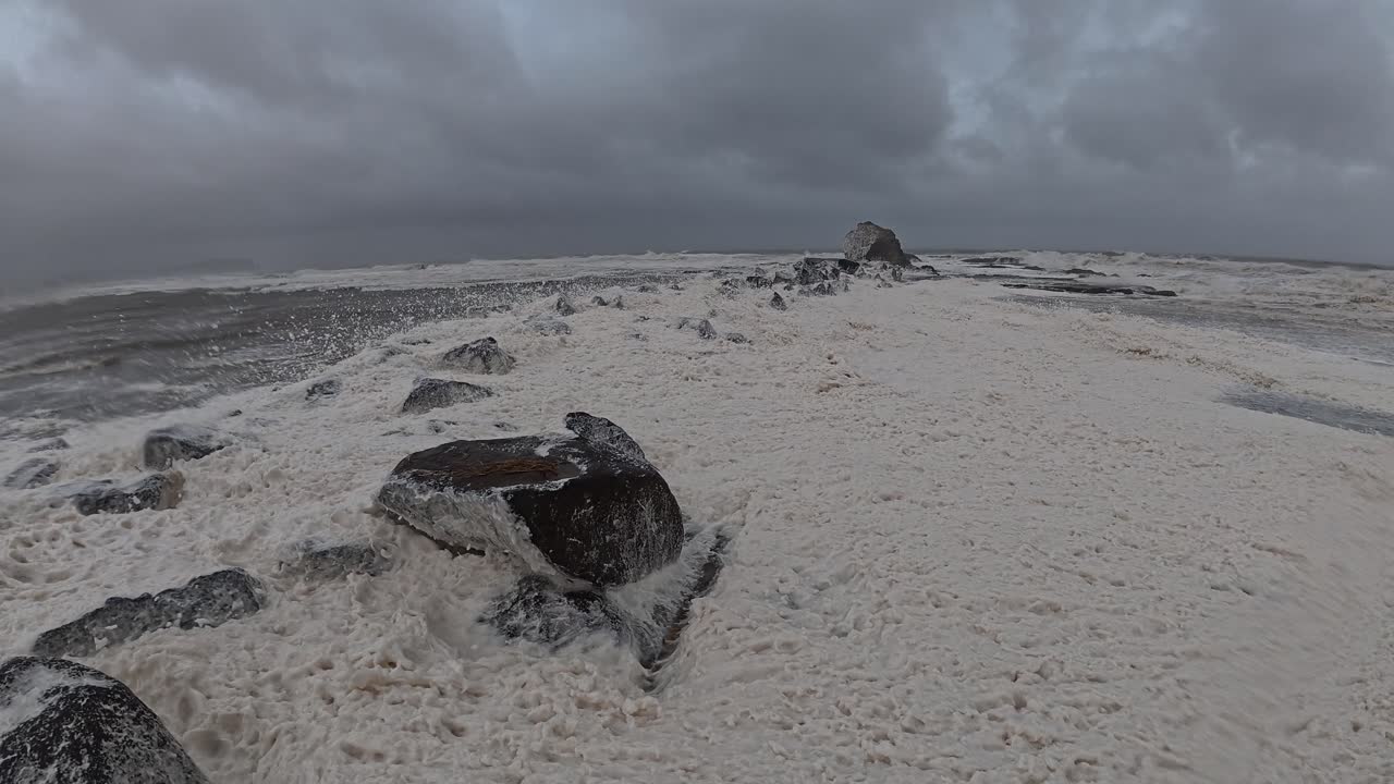 Cyclone Alfred - Sea Foam Blown By Strong Wind At Currumbin Beach During Cyclone In Queensland, Australia. - wide shot