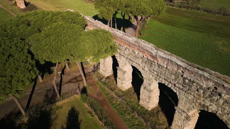 beautiful aerial view of ancient roman aqueduct near rome, italy