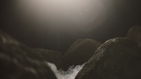 close up view of rocks in the smoke, mountains at night