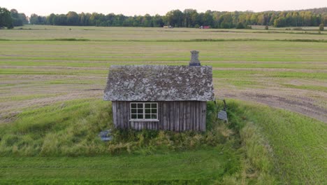 historic blacksmith shop in dalsland's rural landscape, sweden – pull back aerial