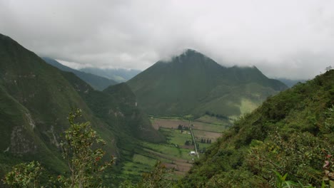 valley beneath high ecuador green hills with cloudy sky