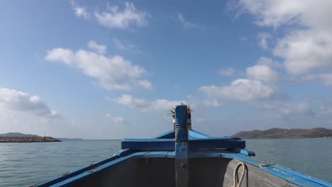 a panning shot from left to right on a ferry boat showing the bow and the horizon in front of the boat