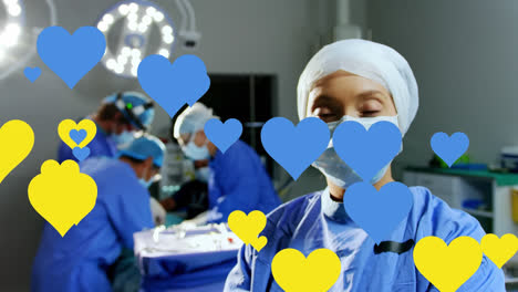 animación de corazones amarillos y azules flotando sobre una cirujana caucásica con máscara facial