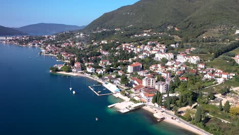 town at adriatic sea coast with houses and boat marines