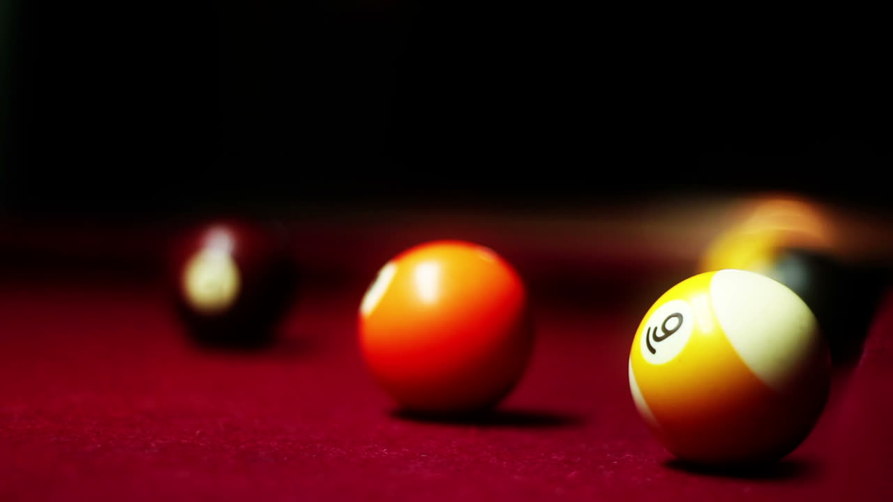 Close-up of Billiard Balls on a Red Pool Table